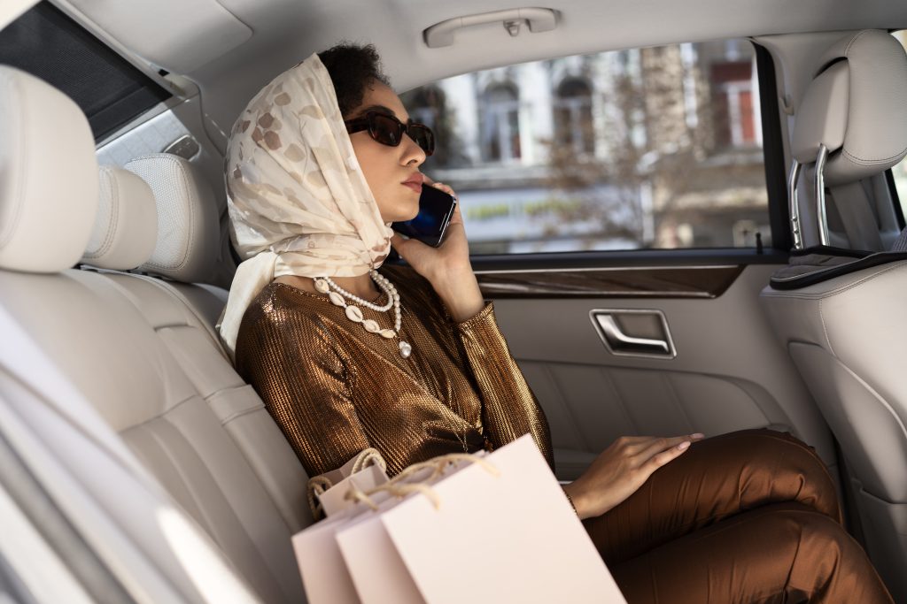 side-view-rich-woman-sitting-car-1024x683