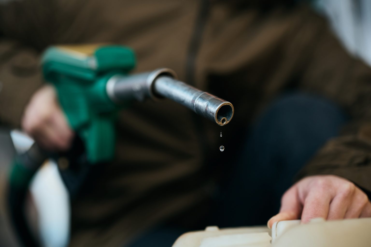 close-up-of-woman-fills-a-gallon-with-car-fuel-at-2026-03-16-03-28-07-utc-1536x1024